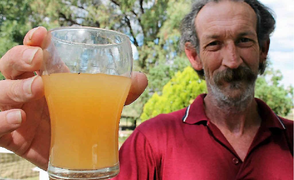 Brett Reid says the water looks like flat beer. He wants council to improve bore water supply at Pratten. Brett Reid says the water looks like flat beer. He wants council to improve bore water supply at Pratten.